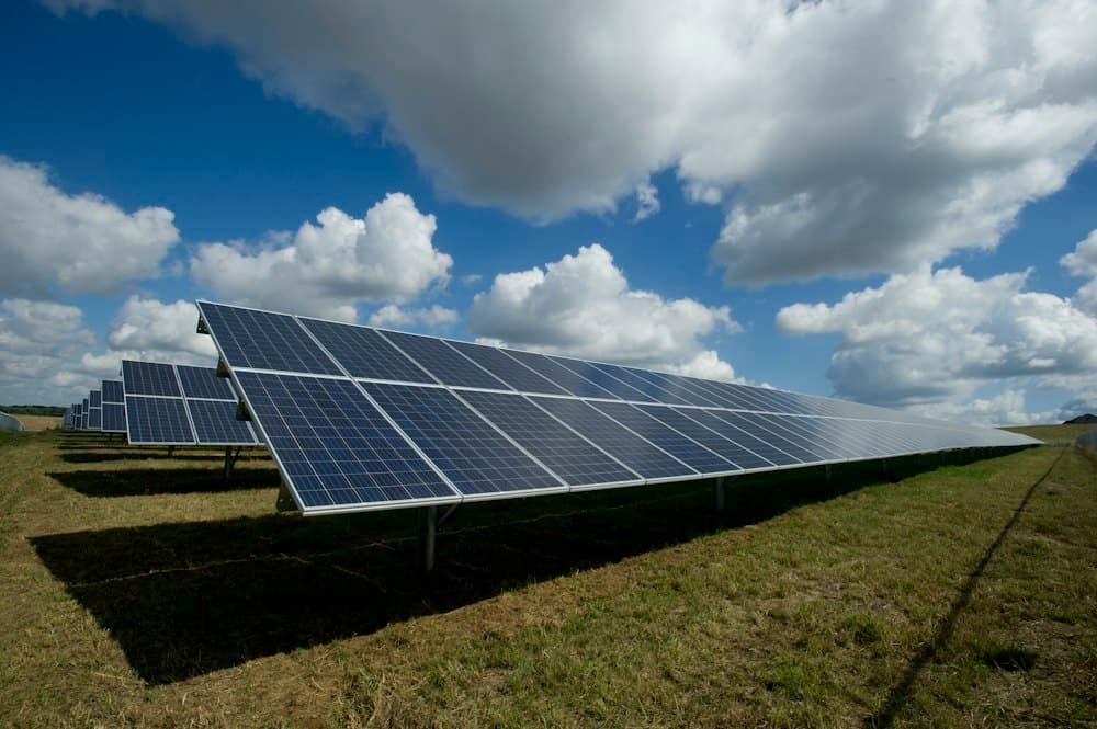 High efficiency rooftop solar installation under bright blue sky